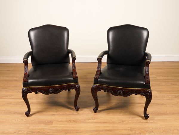 RALPH LAUREN; A PAIR OF CLIVEDON CARVED BRASS STUDDED BLACK LEATHER UPHOLSTERED OPEN ARMCHAIRS WITH CARVED HARDWOOD FRAMES (2)