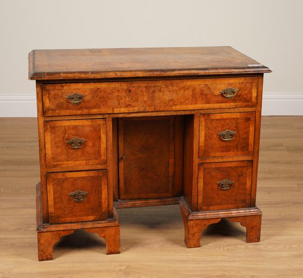 AN 18TH CENTURY CROSSBANDED FIGURED WALNUT KNEEHOLE DESK