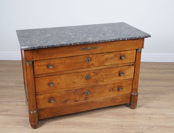 AN EARLY 19TH CENTURY FRENCH MARBLE TOPPED GILT METAL MOUNTED WALNUT FOUR DRAWER COMMODE