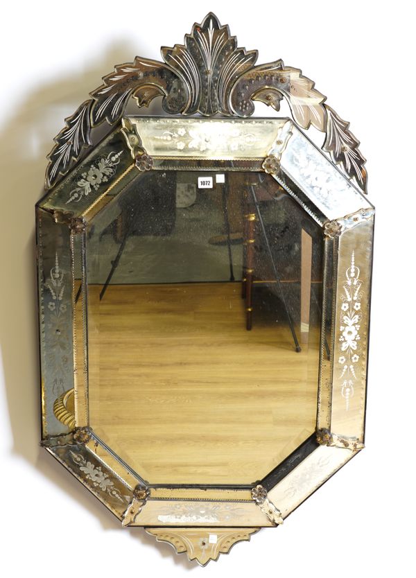 AN EARLY 20TH CENTURY CUSHION FRAMED ETCHED GLASS VENETIAN WALL MIRROR