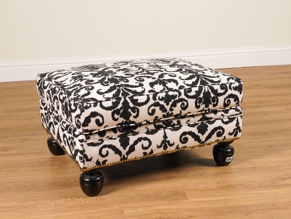 RALPH LAUREN; A RECTANGULAR FOOTSTOOL IN STUDDED BLACK AND WHITE PATTERNED UPHOLSTERY