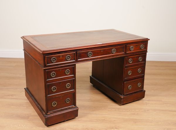 A 19TH CENTURY MAHOGANY NINE DRAWER PEDESTAL DESK