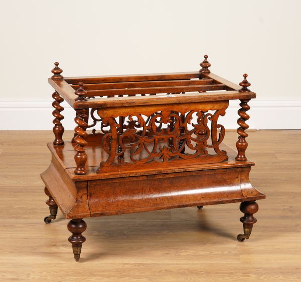 A VICTORIAN FRET CARVED FIGURED WALNUT CANTERBURY