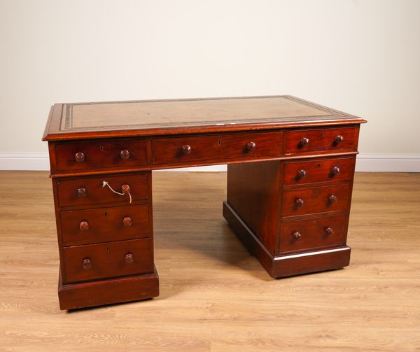 A 19TH CENTURY MAHOGANY NINE DRAWER PEDESTAL DESK