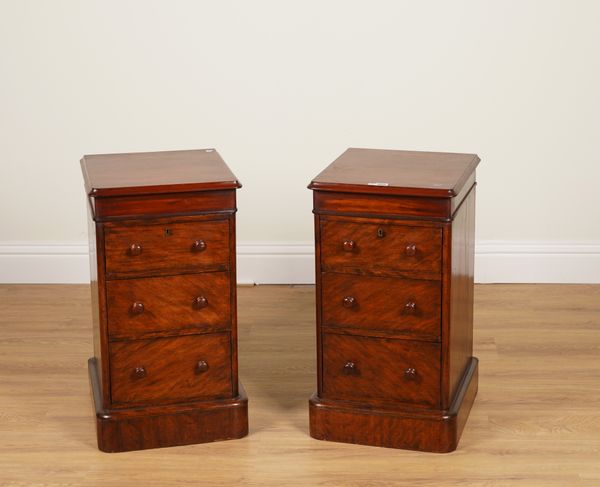 A PAIR OF MAHOGANY THREE DRAWER BEDSIDE TABLES (2)