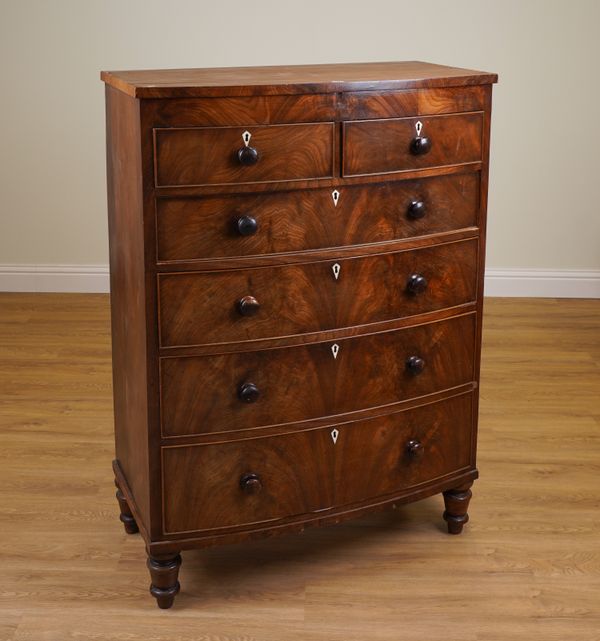 A TALL EARLY VICTORIAN MAHOGANY BOWFRONT CHEST