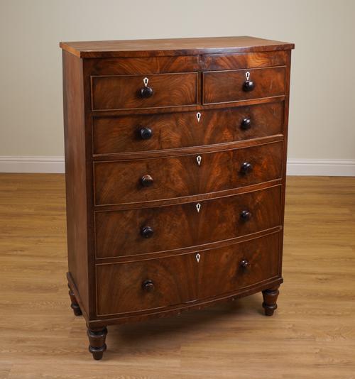 A TALL EARLY VICTORIAN MAHOGANY BOWFRONT CHEST