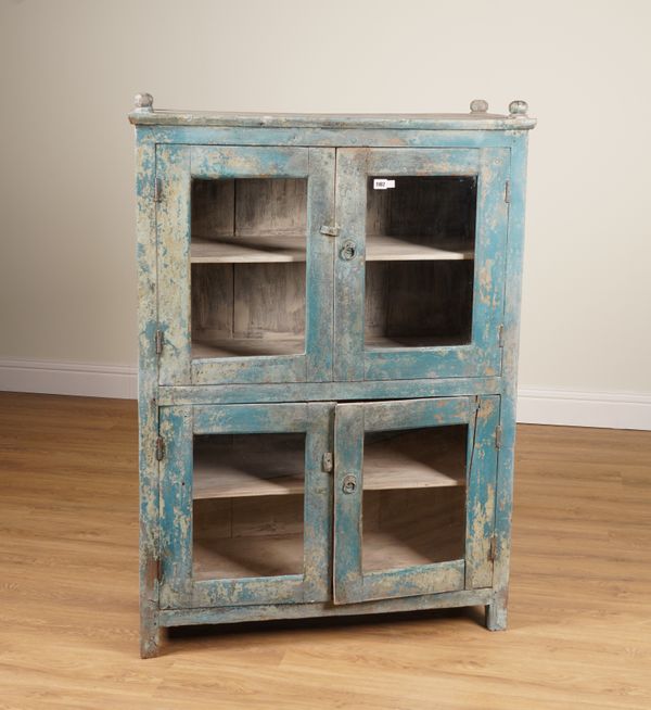 A 19TH CENTURY EASTERN, LATER DISTRESSED, BLUE PAINTED GLAZED DOUBLE HEIGHT CUPBOARD