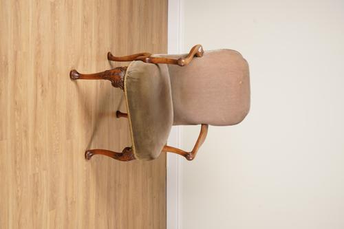 A GEORGE II STYLE CARVED WALNUT FRAMED OPEN ARMCHAIR
