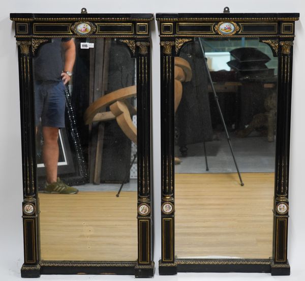 A PAIR OF VICTORIAN CERAMIC AND GILT METAL MOUNTED EBONISED PIER MIRRORS (2)