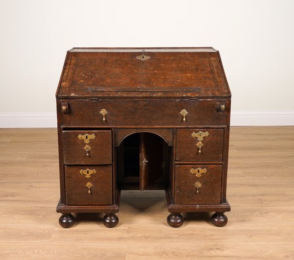 AN 18TH CENTURY OAK KNEEHOLE BUREAU