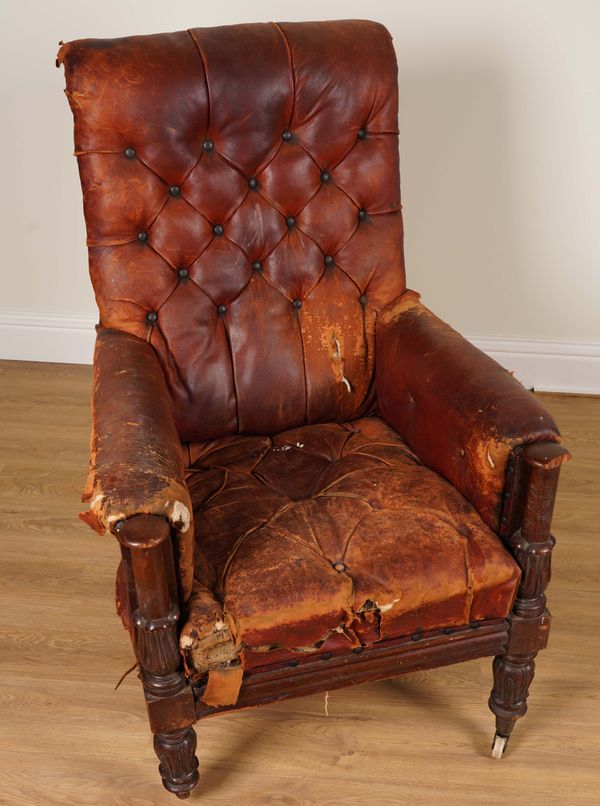 A WILLIAM IV LEATHER UPHOLSTERED CARVED MAHOGANY FRAMED EASY ARMCHAIR