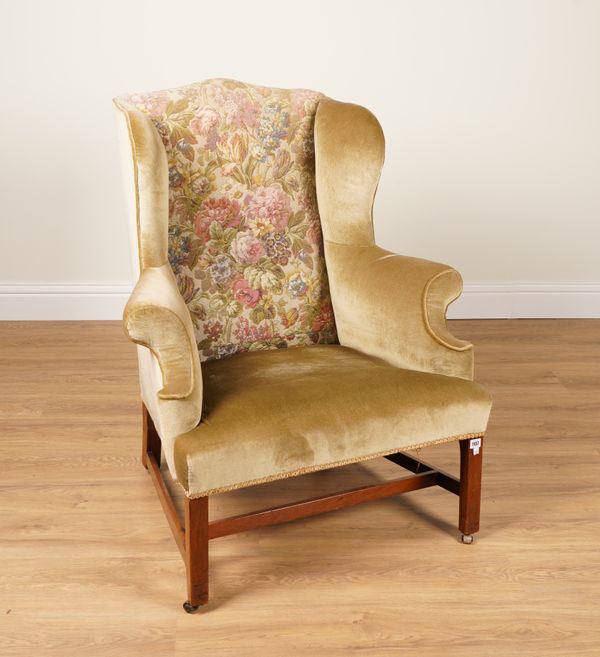 A GEORGE III MAHOGANY FRAMED WINGBACK ARMCHAIR