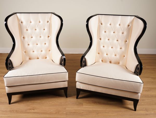 CHRISTOPHER GUY; A PAIR OF MAJESTIC BLACK LACQUER FRAMED CREAM UPHOLSTERED CHAIRS (2)