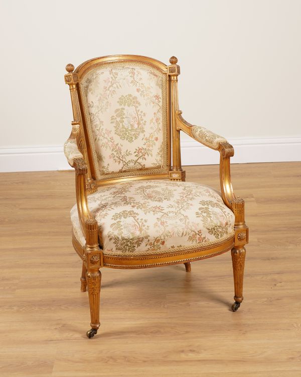 A LATE 19TH CENTURY FRENCH GILT FRAMED OPEN ARMCHAIR OF LOUIS XVI DESIGN