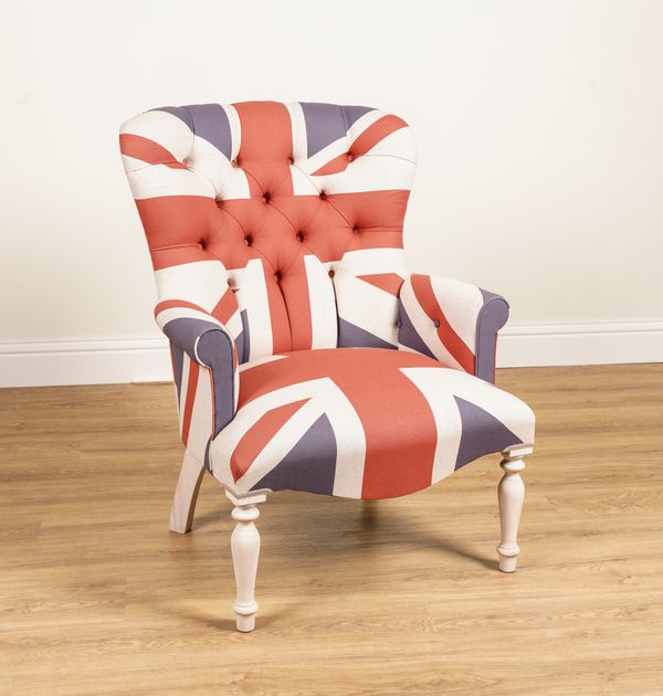 A UNION JACK UPHOLSTERED EASY ARMCHAIR ON BLEACHED BALUSTER SUPPORTS