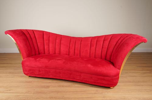 CHRISTOPHER GUY; A DITA RED SUEDE UPHOLSTERED GILT FRAME SOFA