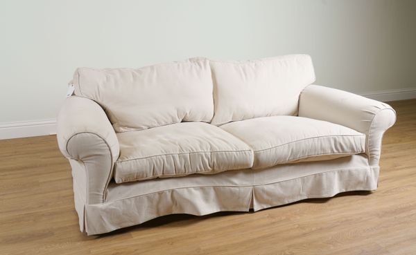 DURESTA; A DEEP SEAT SOFA WITH LOOSE CREAM COVERS