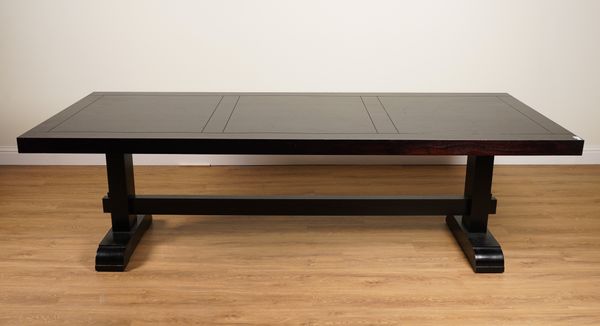 AN EBONISED RECTANGULAR KITCHEN TABLE ON BLOCK TRESTLE SUPPORTS