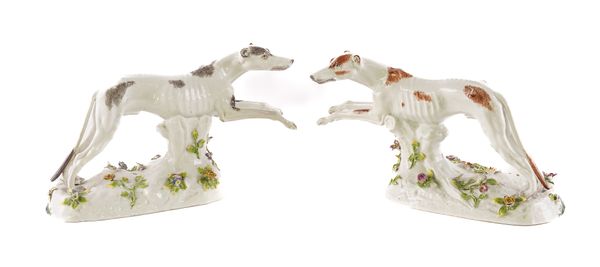 A PAIR CONTINENTAL PORCELAIN MODELS OF GREYHOUNDS (2)