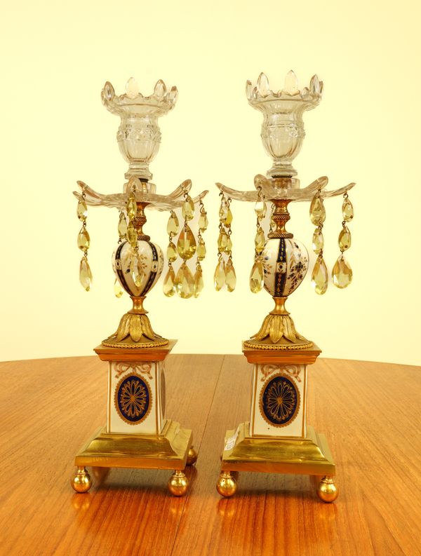 A PAIR OF CUT GLASS, GILT-BRASS AND PORCELAIN CANDLESTICKS (2)