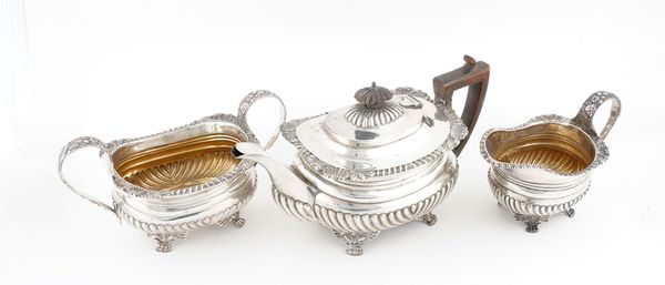 A SILVER COMPOSITE THREE PIECE TEA SET