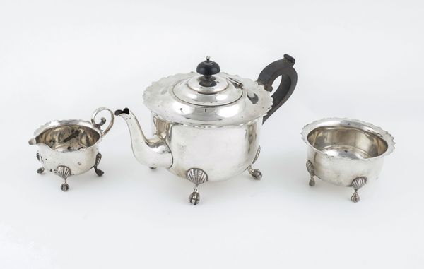 A SILVER COMPOSITE THREE PIECE TEA SET