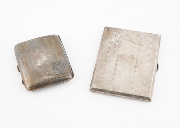 TWO SILVER RECTANGULAR CIGARETTE CASES (2)