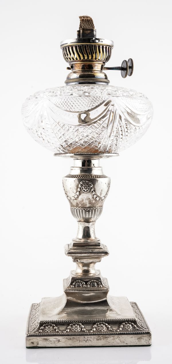 A LATE VICTORIAN SILVER AND CUT GLASS OIL LAMP