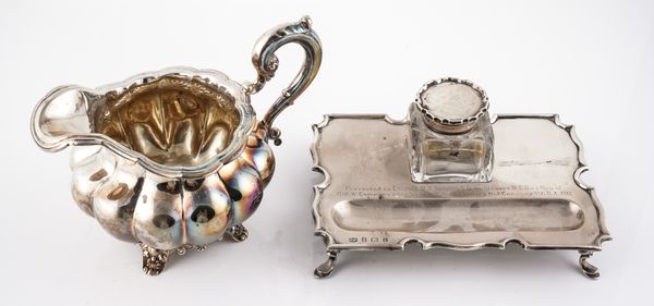 A SILVER INKSTAND AND A SILVER MILK JUG (2)