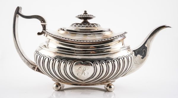 A GEORGE III SILVER TEAPOT