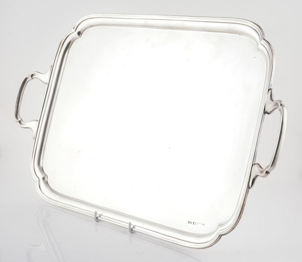 A SILVER SHAPED RECTANGULAR TWIN HANDLED TRAY