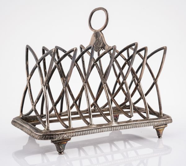 A GEORGE III SILVER SEVEN BAR TOASTRACK