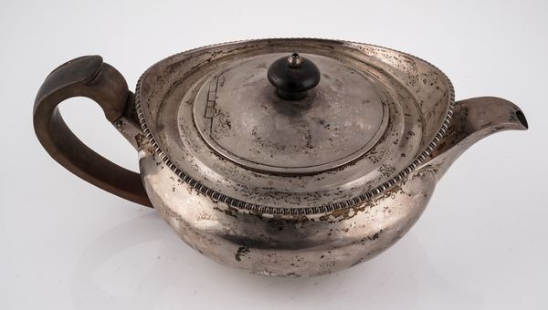 A GEORGE III SILVER TEAPOT