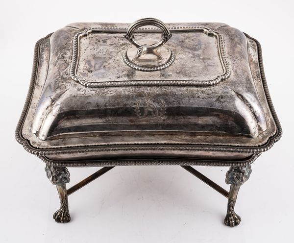 A SILVER LIDDED ENTREE DISH WITH A SILVER STAND