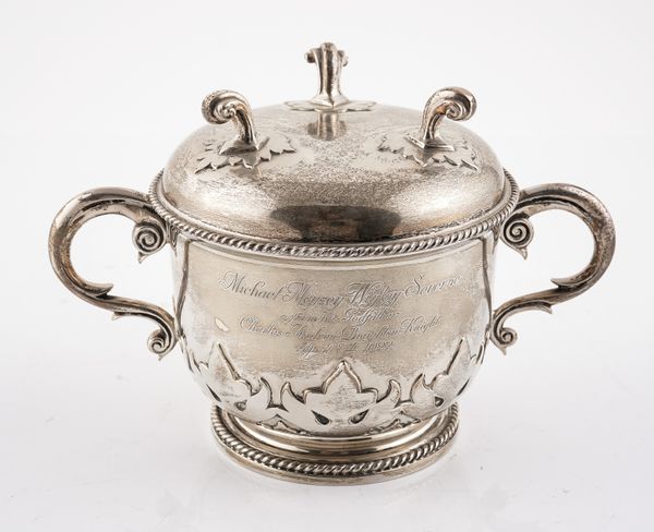 A SILVER TWIN HANDLED CHRISTENING PORRINGER AND COVER