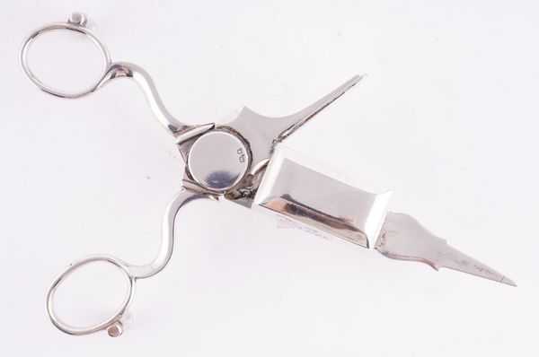 A PAIR OF SILVER CANDLE SNUFFERS