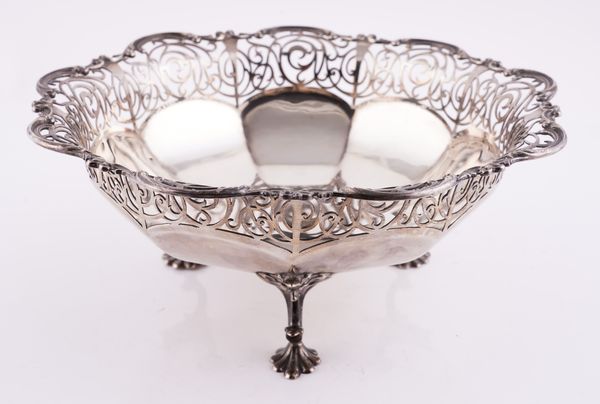 A SILVER CAKE OR FRUIT BASKET