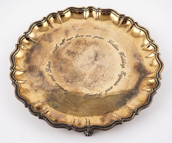 A SILVER GILT SHAPED CIRCULAR SALVER