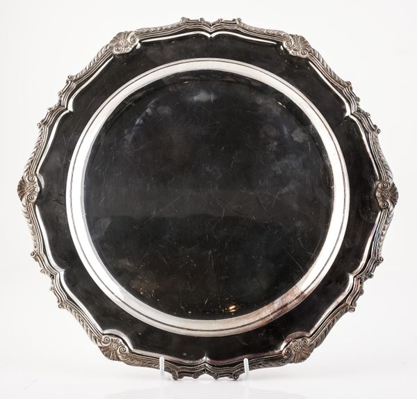 A SILVER SHAPED CIRCULAR DISH