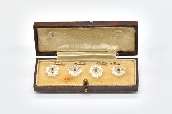 A SET OF FOUR GOLD, RUBY AND ROCK CRYSTAL DRESS BUTTONS