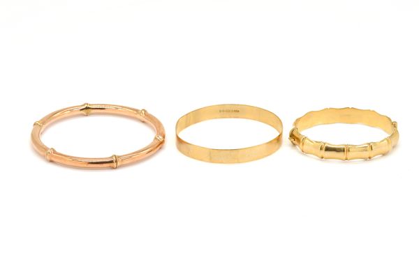 THREE GOLD BANGLES (3)