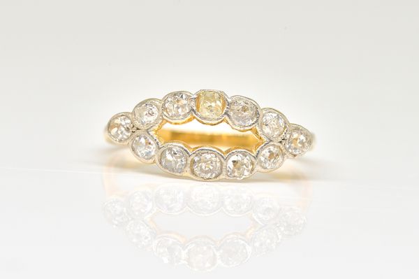 A GOLD AND DIAMOND RING