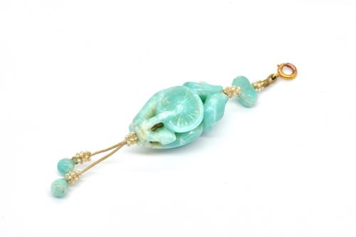 A CARVED CHRYSOPRASE AND SEED PEARL PENDANT