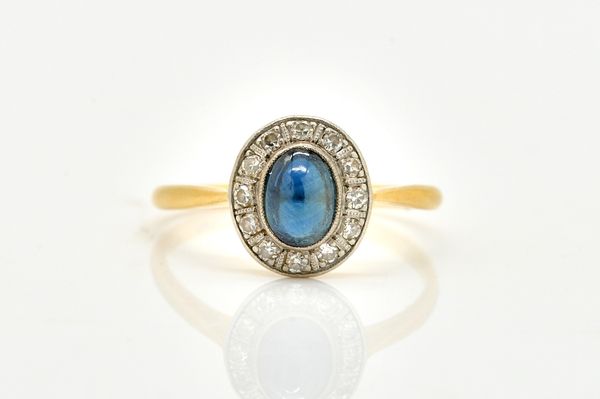 A SAPPHIRE AND DIAMOND RING