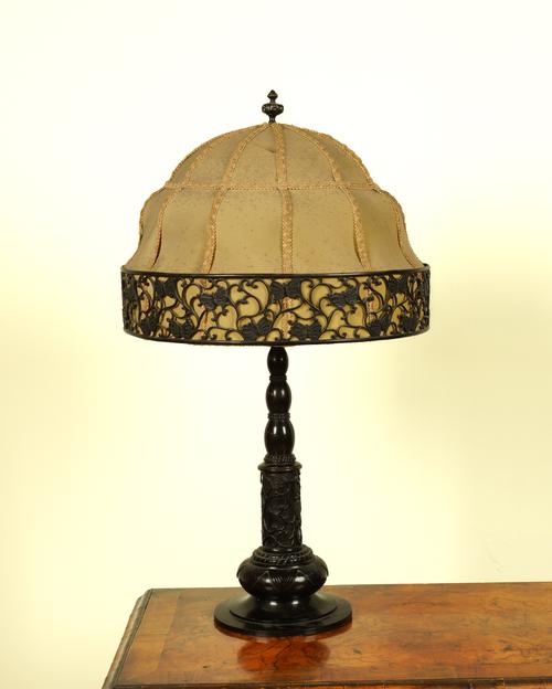 A BRONZE PATINATED METAL TWIN-LIGHT TABLE LAMP