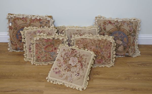 A GROUP OF EIGHT VARIOUS NEEDLEPOINT CUSHIONS WITH TASSELLED FRINGES (8)