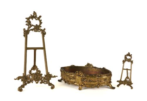 A ROCOCO STYLE GILT-BRONZE OVAL JARDINIERE; TOGETHER WITH A PAIR OF BRASS PORTRAIT PLAQUE EASEL SUPPORTS (3)