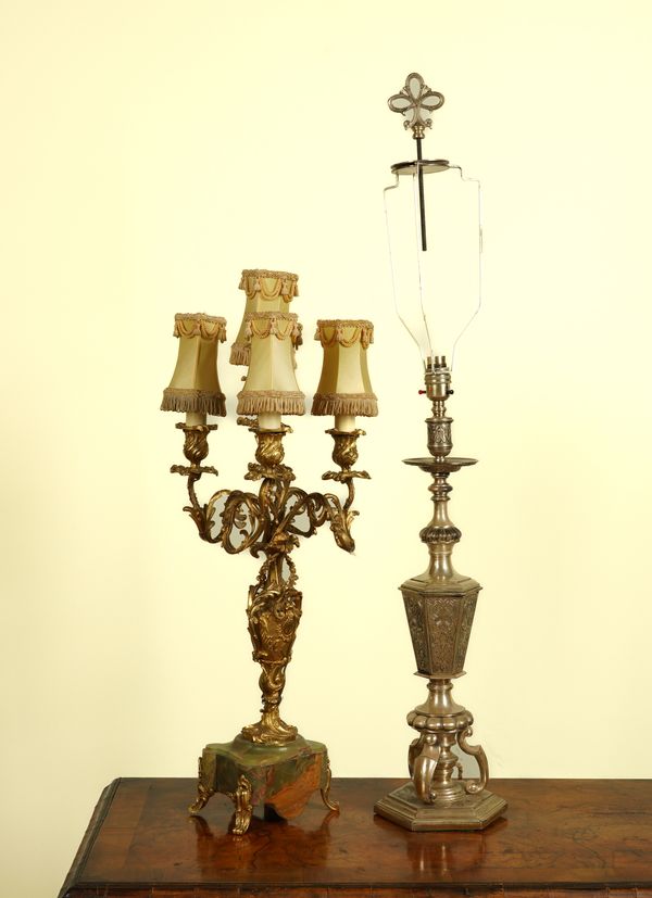 A ROCOCO STYLE GILT-METAL MOUNTED ONYX FIVE LIGHT TABLE LAMP; TOGETHER WITH A SILVERED BRONZE TABLE LAMP (2)