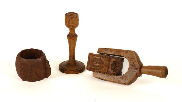 ROBERT ‘MOUSEMAN’ THOMPSON OF KILBURN: AN OAK OCTAGONAL FACETED NAPKIN RING; TOGETHER WITH A BUTTER STAMP AND PASTRY WHEEL (3)